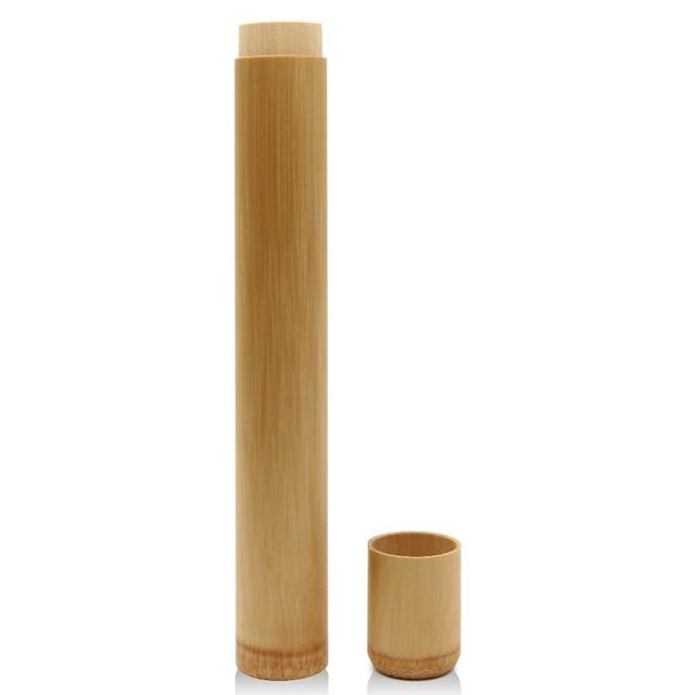 Bamboo travel mug with a matching small cup on a white background