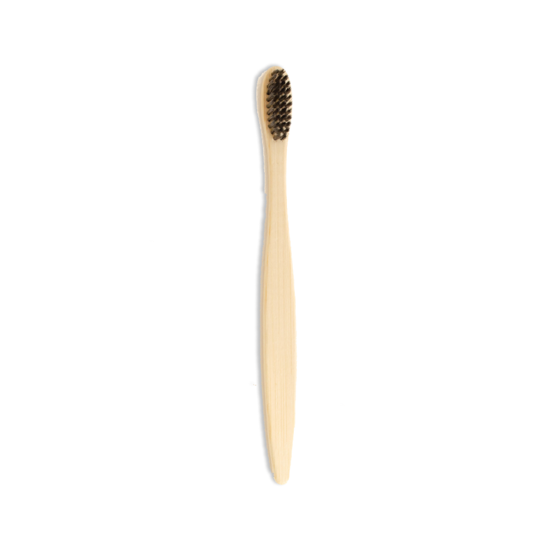Bamboo toothbrush with black bristles on a white background