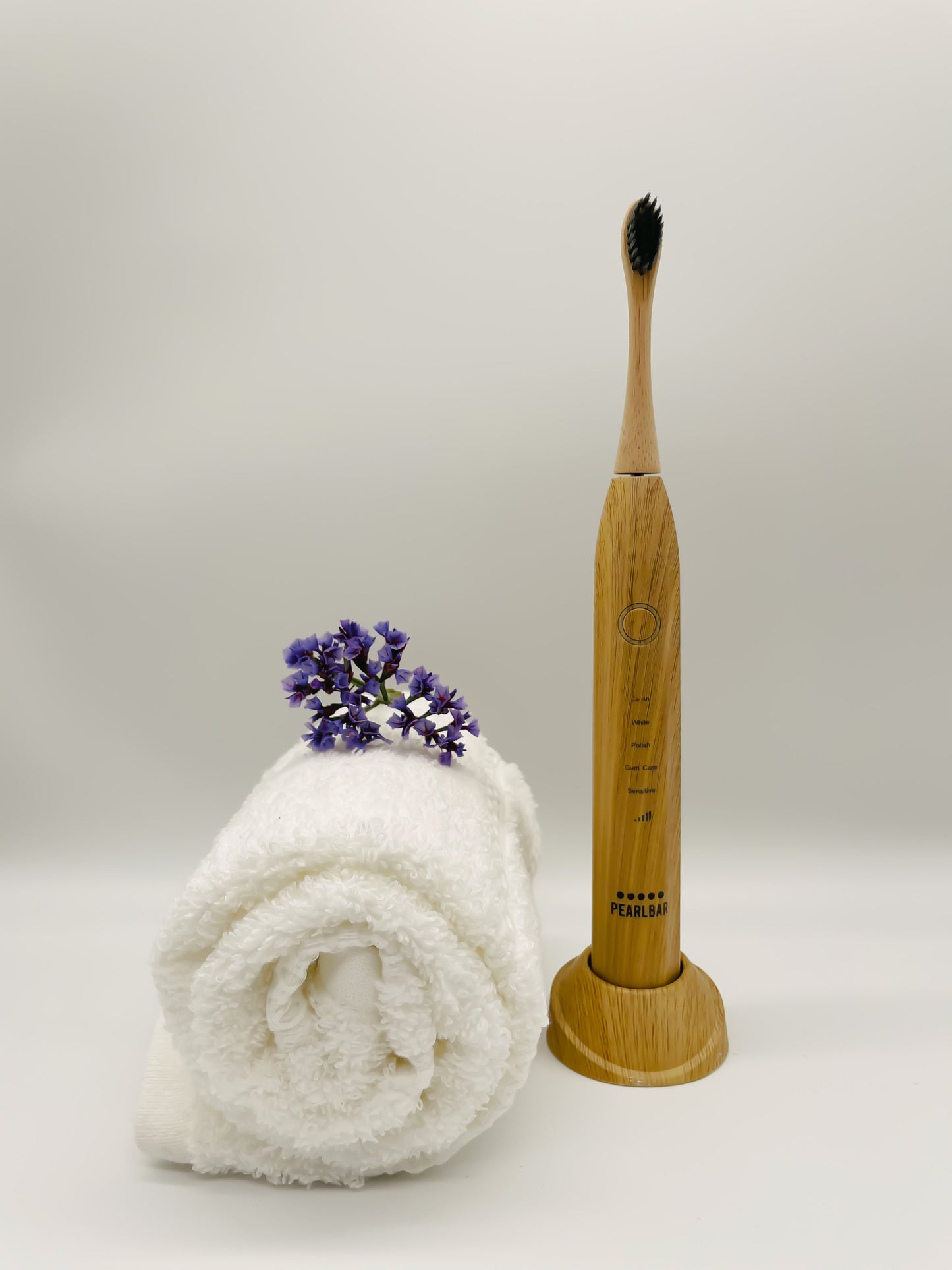 PearlBar rechargeable toothbrush on charging base