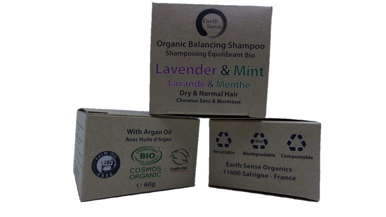 Three boxes of Organic Balancing Shampoo with Lavender & Mint scent on a white background