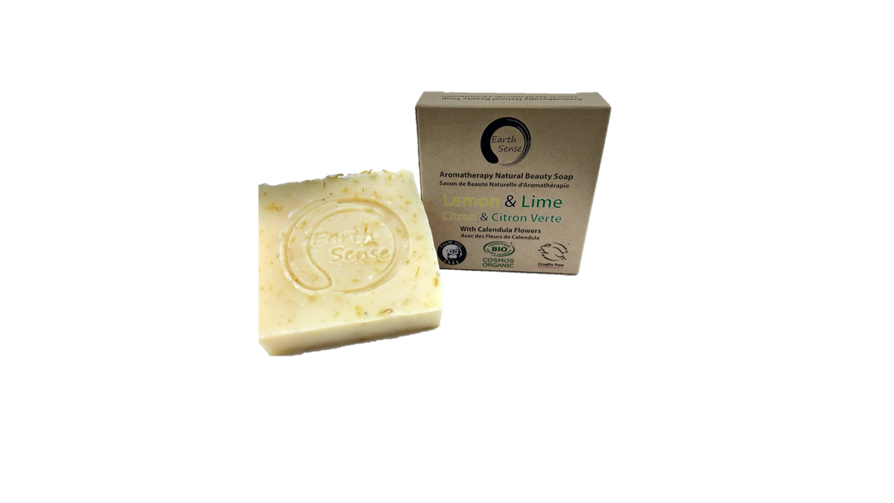 Bar of soap and its packaging on a white background