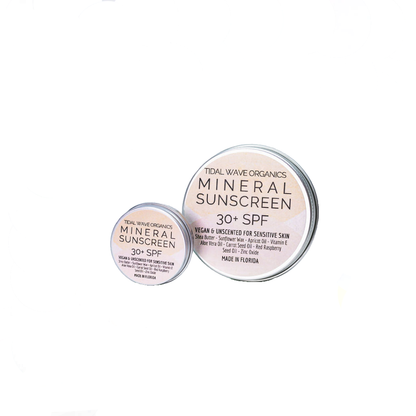 Two tins of Tidal Wave Organics Mineral Sunscreen on a white background