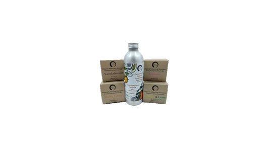 Bottle with a label and three cardboard boxes on a white background
