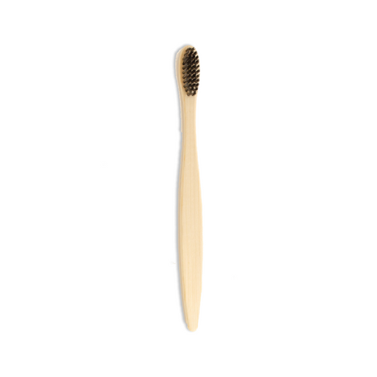 Bamboo toothbrush with black bristles on a white background