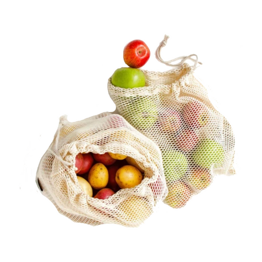 Two mesh produce bags filled with fruits on a white background