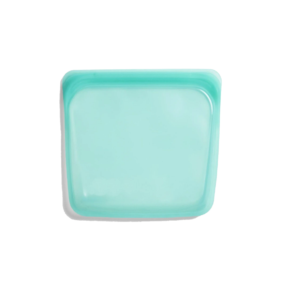 Turquoise square plate on a white background