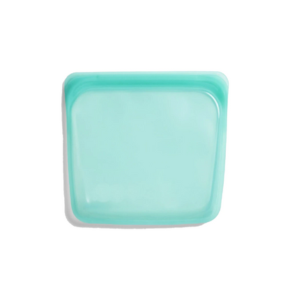 Turquoise square plate on a white background
