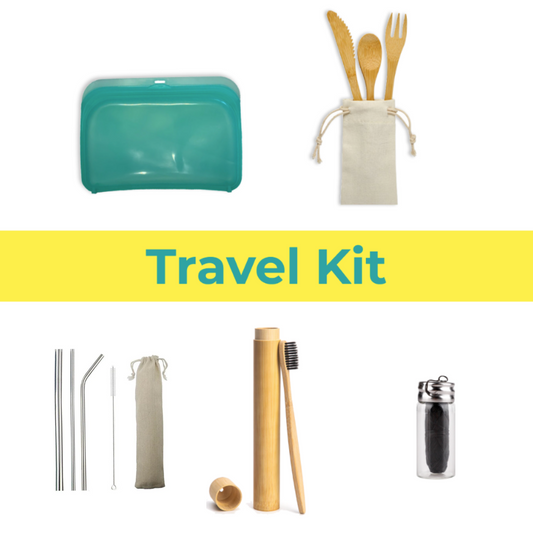 Collection of eco-friendly travel items including a teal pouch, wooden utensils, straws, and toothbrushes on a white background.