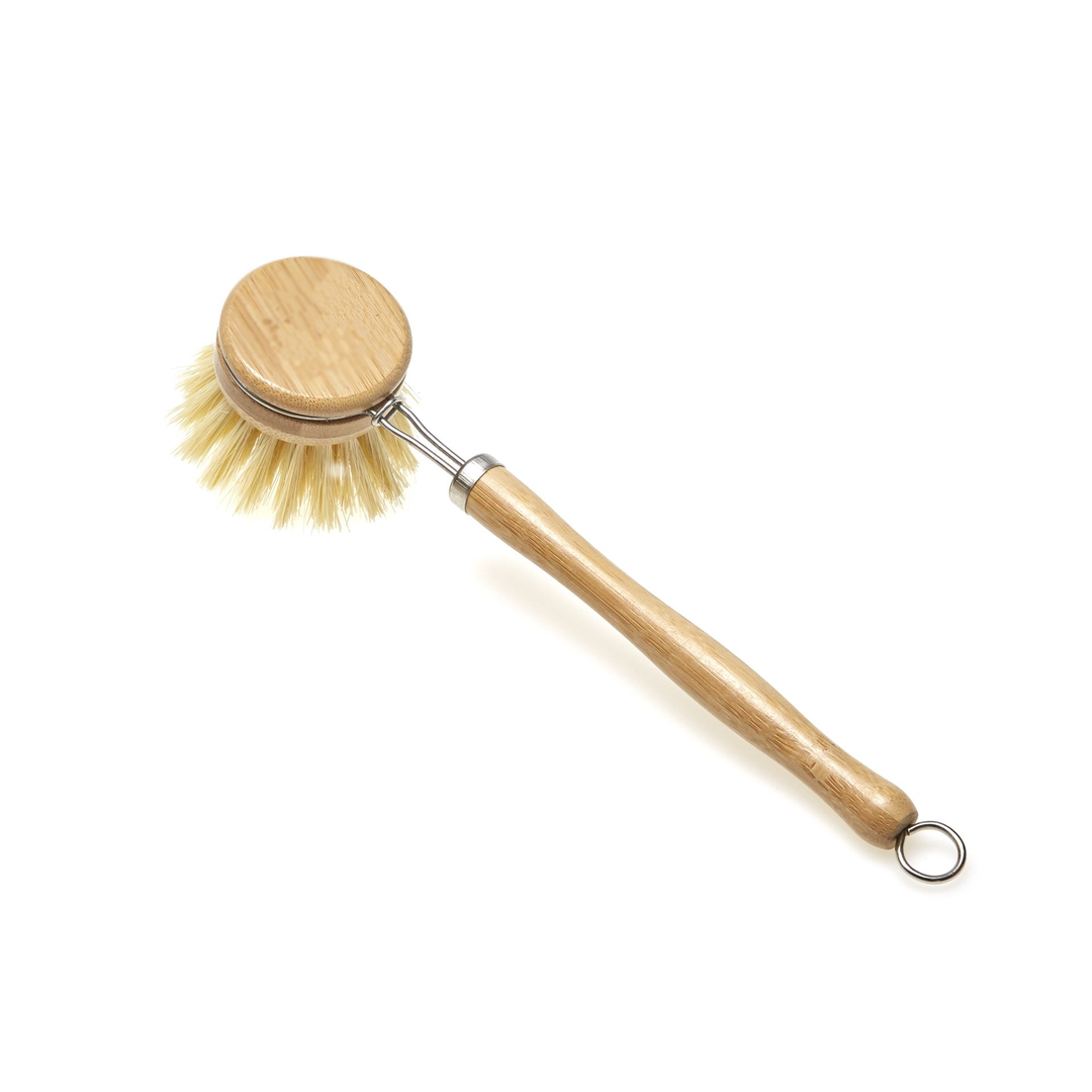 Dish brush with wooden handle and bristle head on a white background