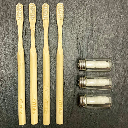 Zero waste oral hygiene kit with bamboo toothbrushes and floss